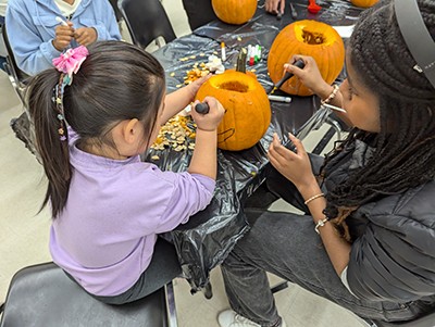 Children carving pumpkins