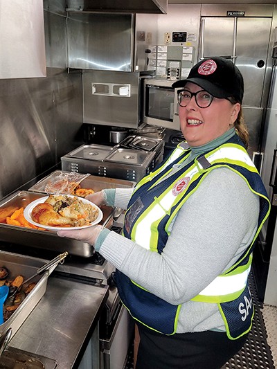 Sharon Cluett serves meals to those in need in downtown St. John’s, N.L