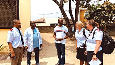 Major Elaine Locke and Major Heather talk with Salvation Army personnel and Eric Christian,