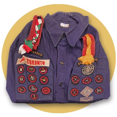 Scout leader uniform made from blue cotton twill from the 3rd Toronto Scout troop with badges
