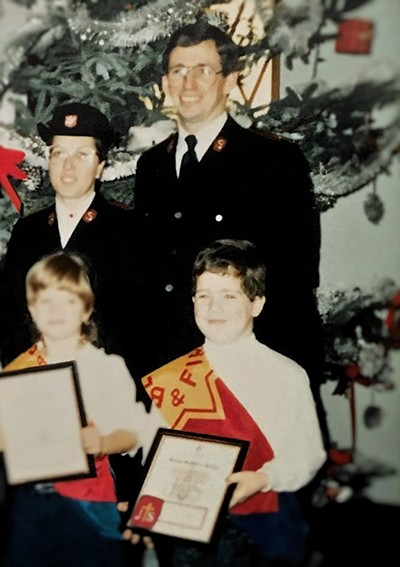 Commissioner Rosalie and General Brian Peddle (Rtd), then captains, enrol Joshua Howard as a junior soldier