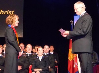 General Brian Peddle greets Cpt Bethany Dueck, now a corps officer in Wingham, Ont., during her ordination and commissioning service. Her brother, Cpt Joshua Howard, then a second-year cadet, sits in the second row
