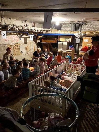 Ukrainians shelter from Russian attacks in a basement bomb shelter