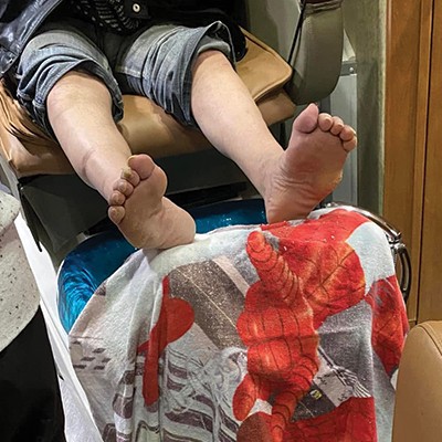 A nurse examines and treats foot problems