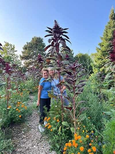Lori Rogers and Rosemary Simone enjoy the flowers