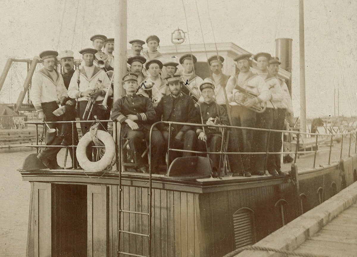 Black and white photo of sailors on a ship