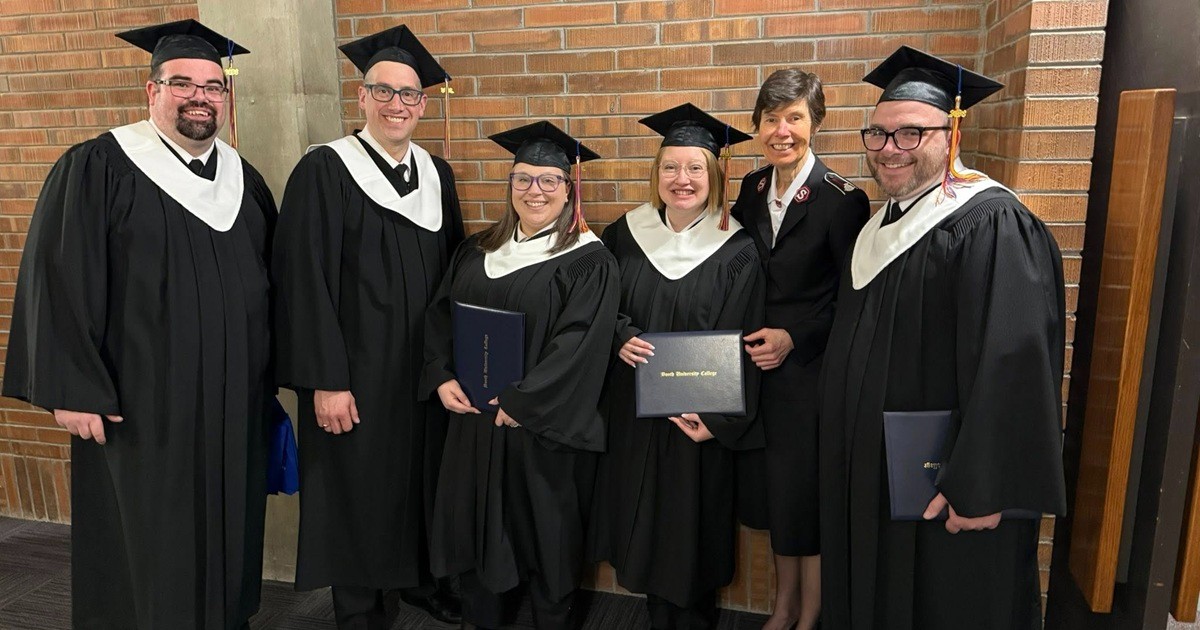 A group of people wearing academic robes and hats