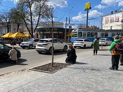 People kneel in the streets 