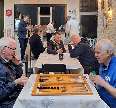 Men play backgammon