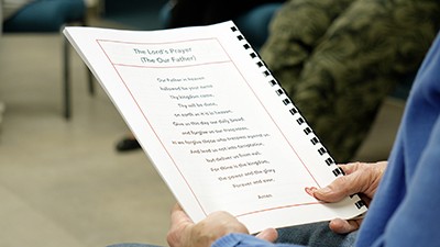 Each song includes a Scripture verse and a short prayer, and the session ends with the Lord’s Prayer