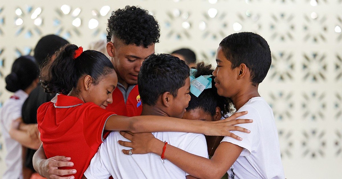 Children of the Salvation Army youth program in Chilibre, Panama, gather in heartfelt prayer