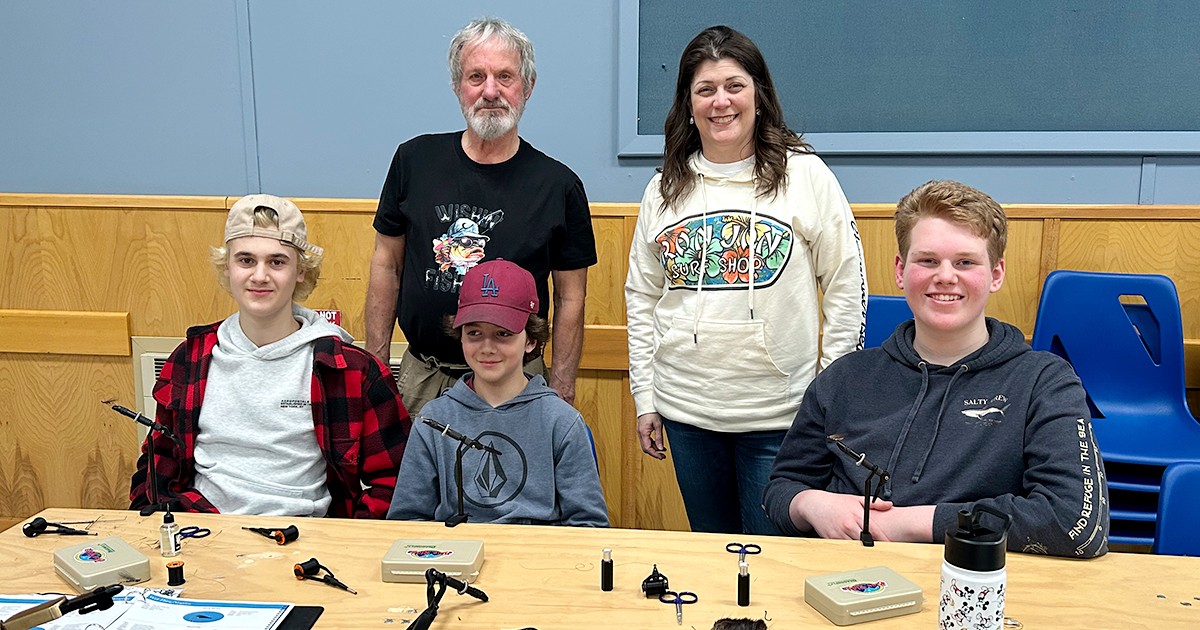 Youth attend a workshop on fly tying 