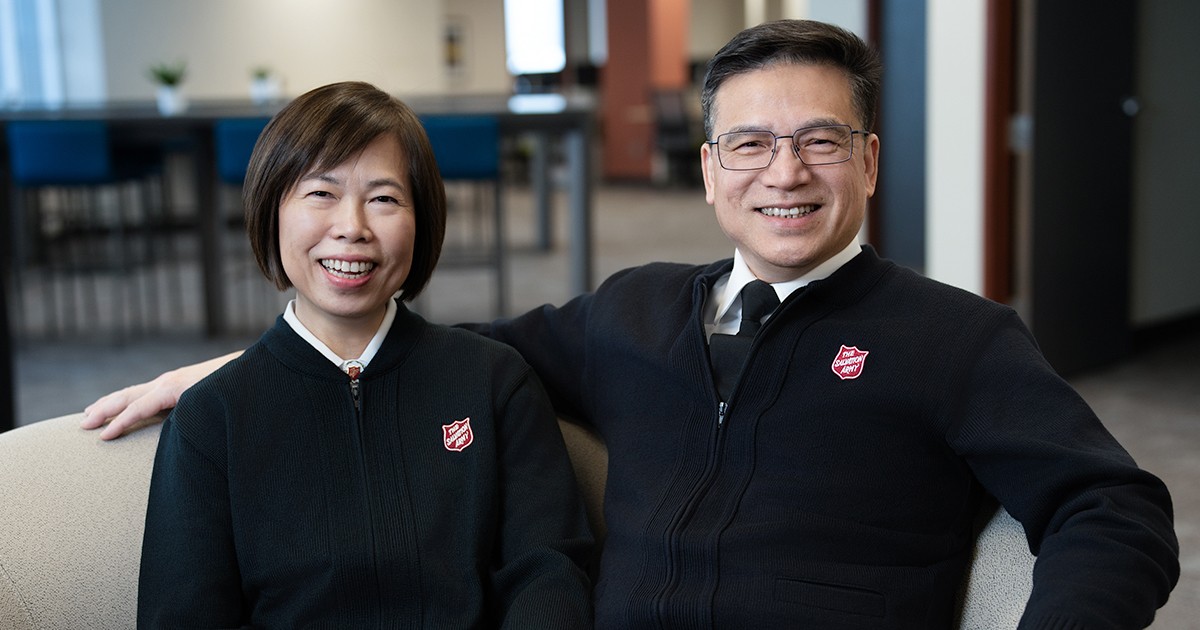 A couple sitting and smiling together