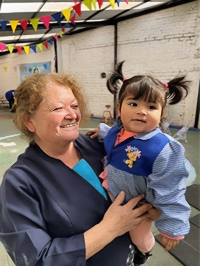 Claudia, who works at Faro de Angeles Kindergarten in Chile, describes the school as a family