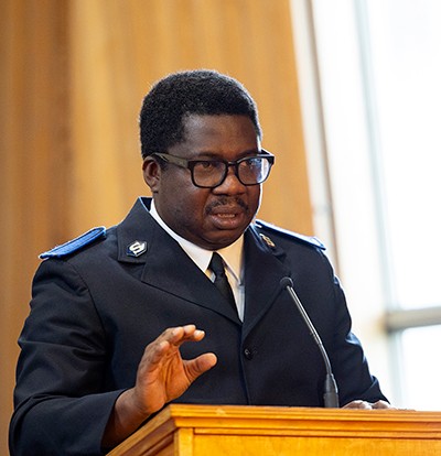 A man speaks at a podium