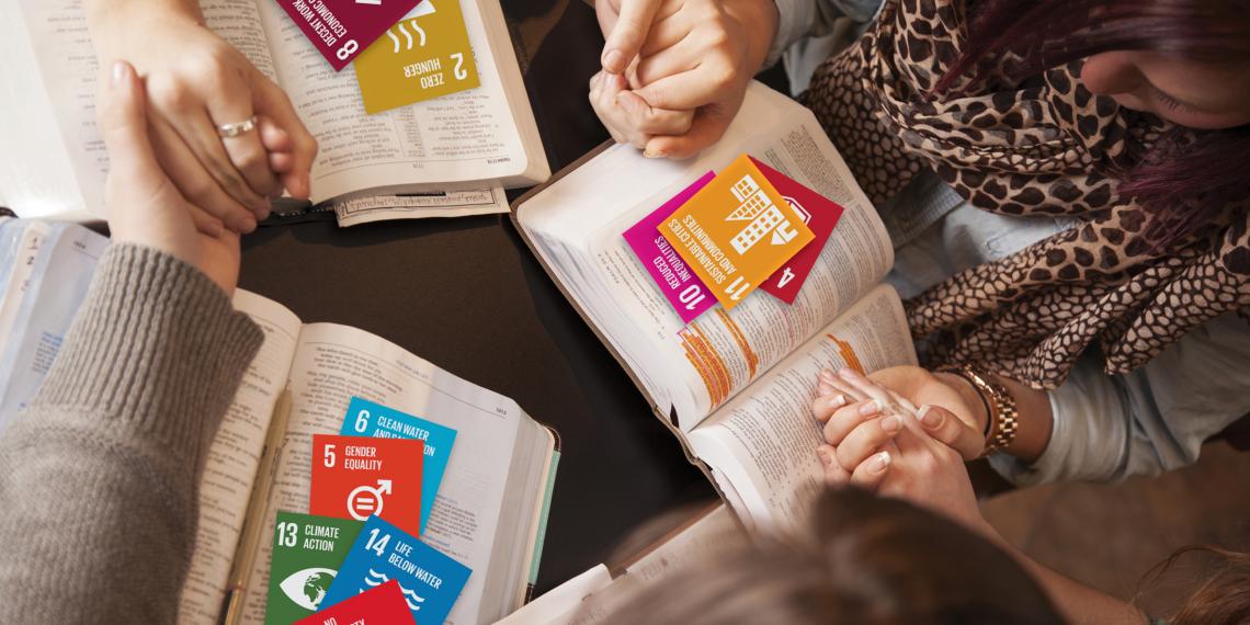 Prayer Squares and Hand Holding Banner