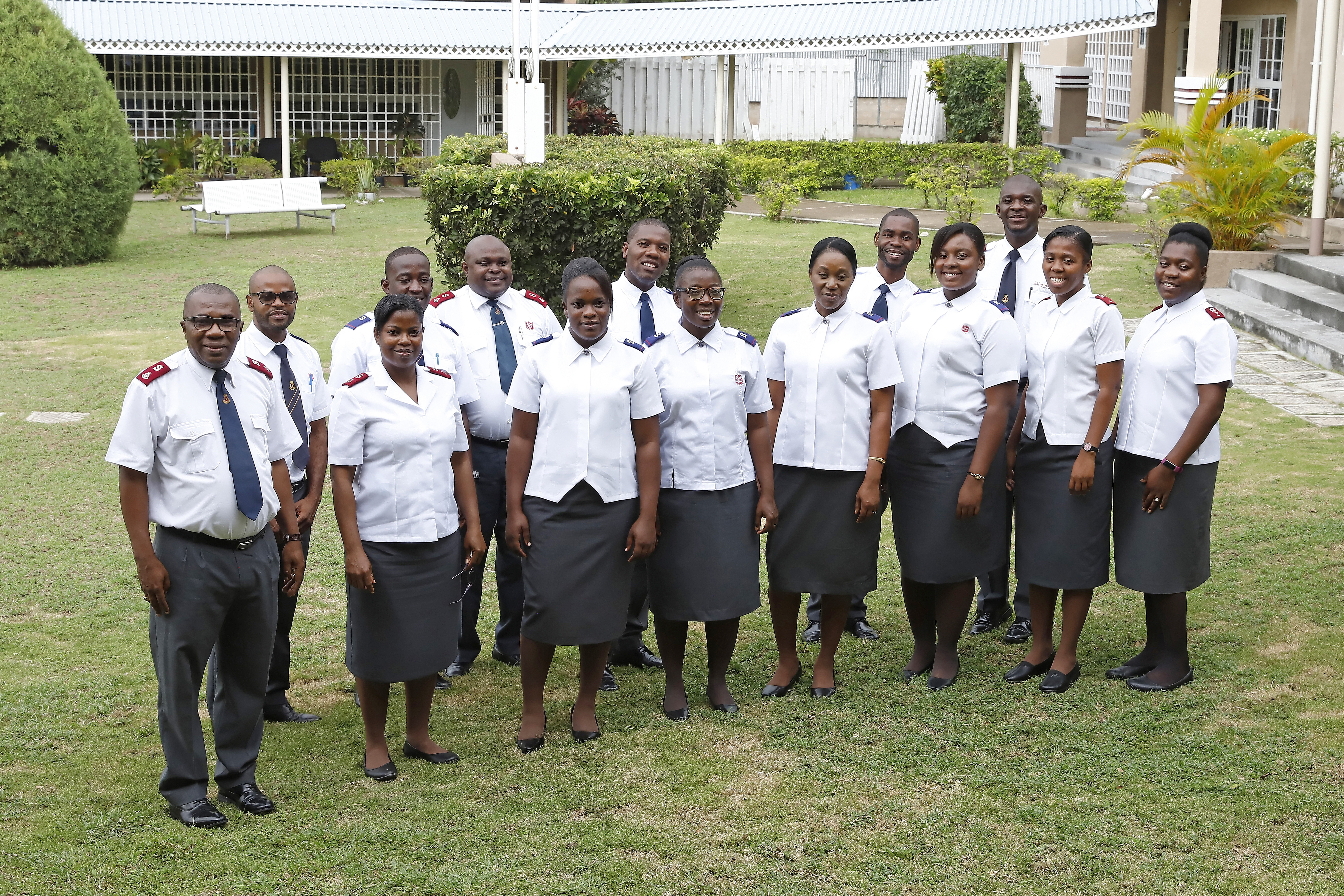 Cadets at Officers Training College in Jamaica standing alongside each other smiling