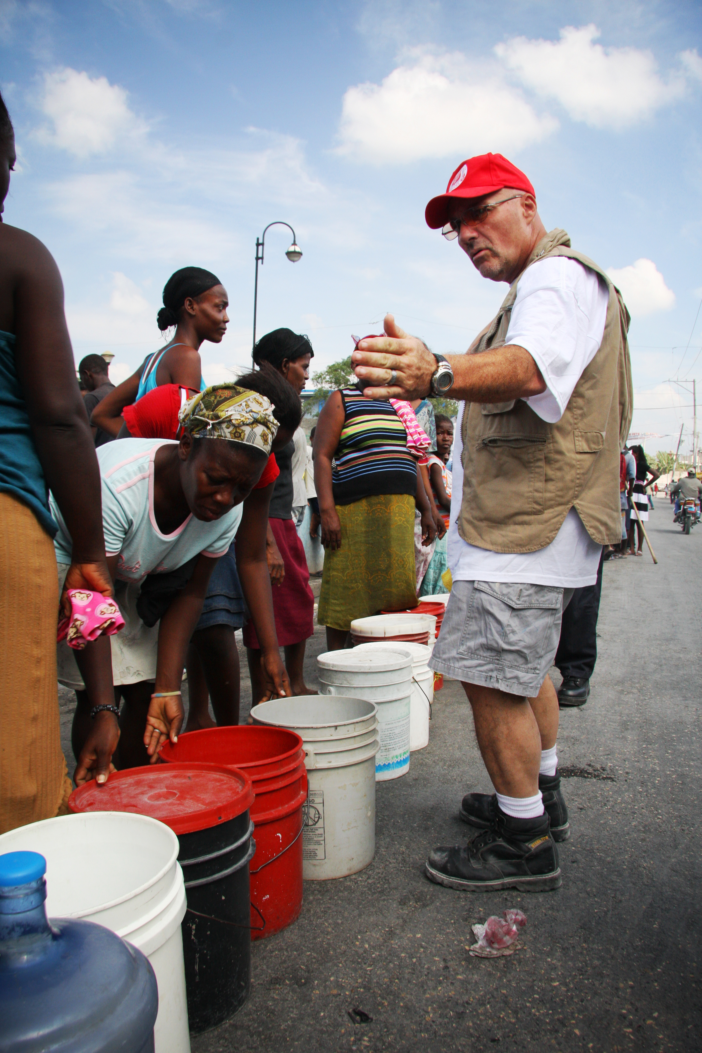 Photo of beneficiaries accepting disaster relief items