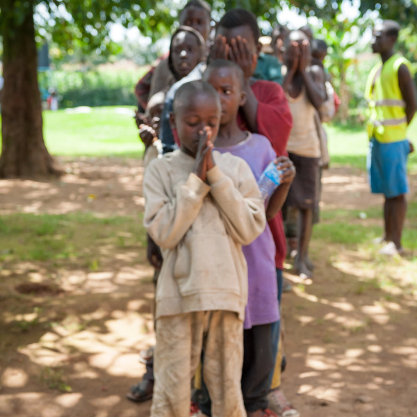 Street boys in Kenya praying